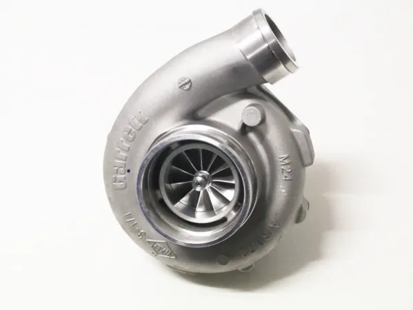 Turbocompresseur GTX3076R GEN II Super Core Garrett argenté. Boîtier métallique brillant avec logo Garrett gravé et modèle indiqué. Roue de compresseur visible, entrée d'air frais en haut. Roulements à billes, sans boîtier d'échappement.