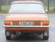 Vue arrière d'une Opel Ascona A 1.6, 1.9 brune avec pare-chocs chromé, feux arrière et plaque d'immatriculation Simons. Sous le véhicule, pot d'échappement sport Simons en acier aluminisé avec embout ovale 70/90 mm.